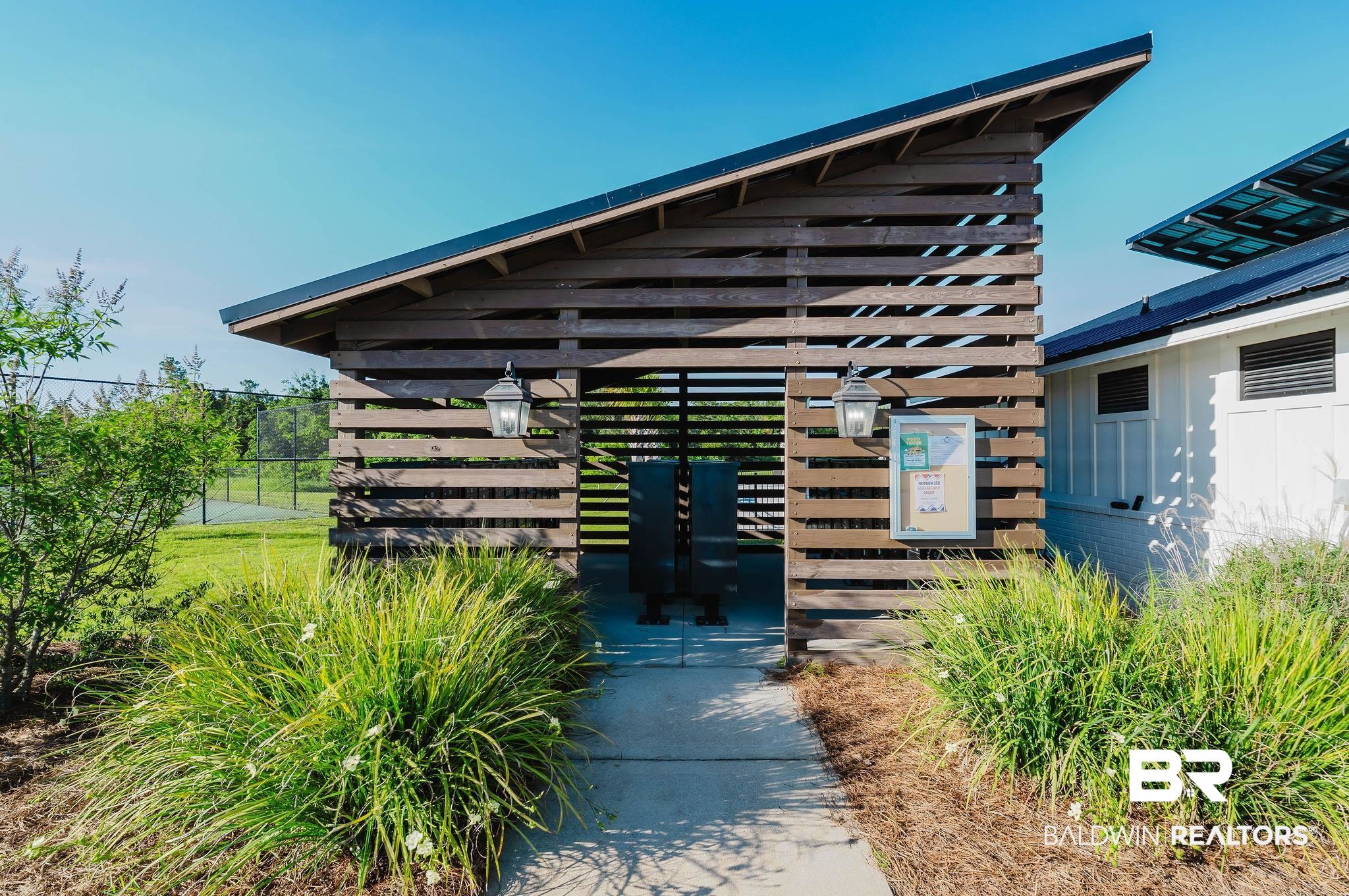 7872 Calverton Street Foley, AL 36535 - Photo 62 of 76 Contemporary wood slat structure with an angled roofline