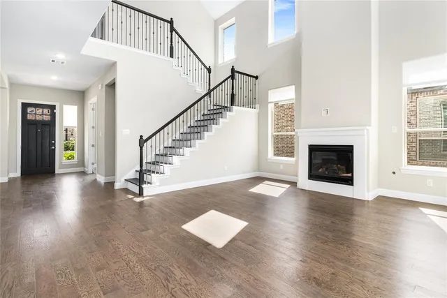 an aerial view of a house with a garden and swimming pool