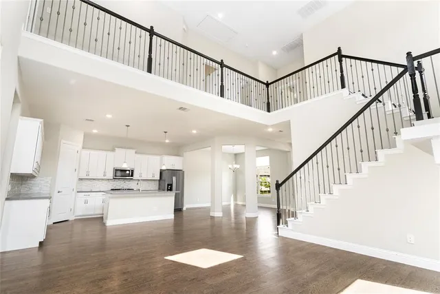 a view of a livingroom with wooden floor and fireplace