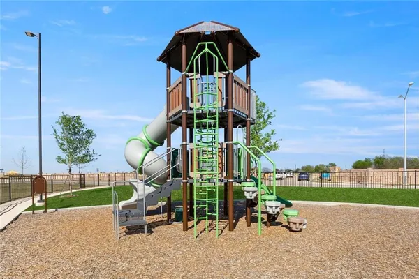 a childrens park with lots of swings and slides