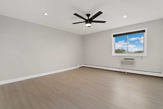 4700 Old Orchard Road, Unit 403 Skokie, IL 60076 - Photo 15 of 21 a view of a big room with wooden floor and windows