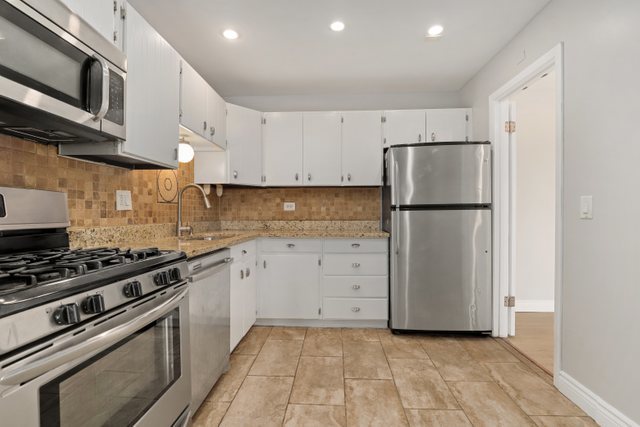 4700 Old Orchard Road, Unit 403 Skokie, IL 60076 - Photo 9 of 21 a kitchen with cabinets a refrigerator and a stove