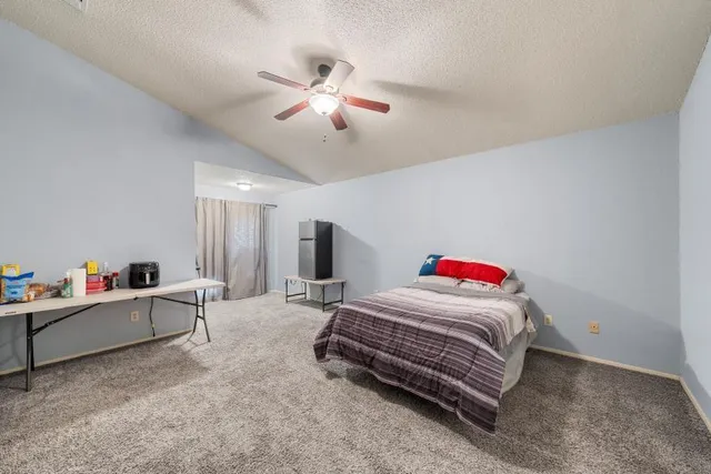 a room with a bed and furniture