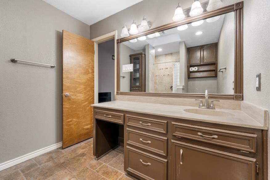 827 Fort Gates Waco, TX 76708 - Photo 18 of 25 a bathroom with a sink a vanity and a mirror