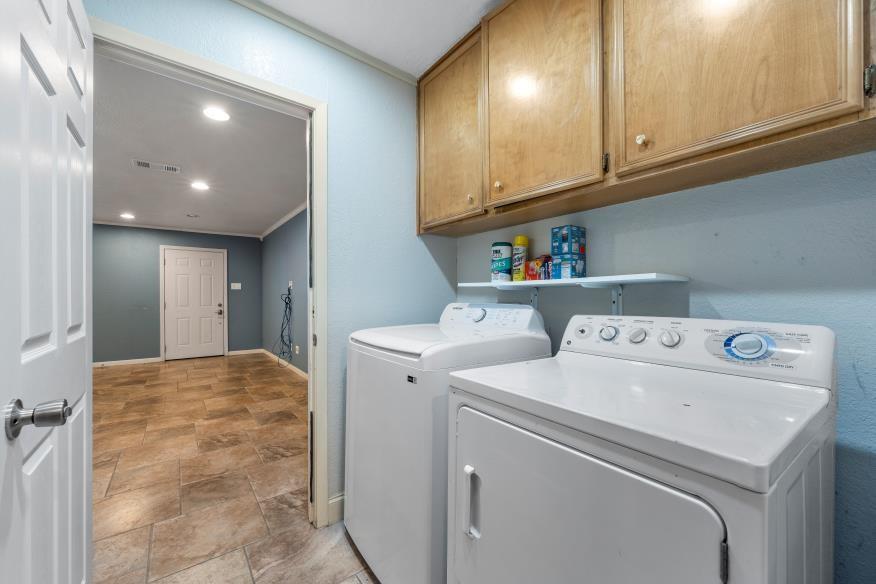 827 Fort Gates Waco, TX 76708 - Photo 7 of 25 a view of storage and utility room with washer and dryer