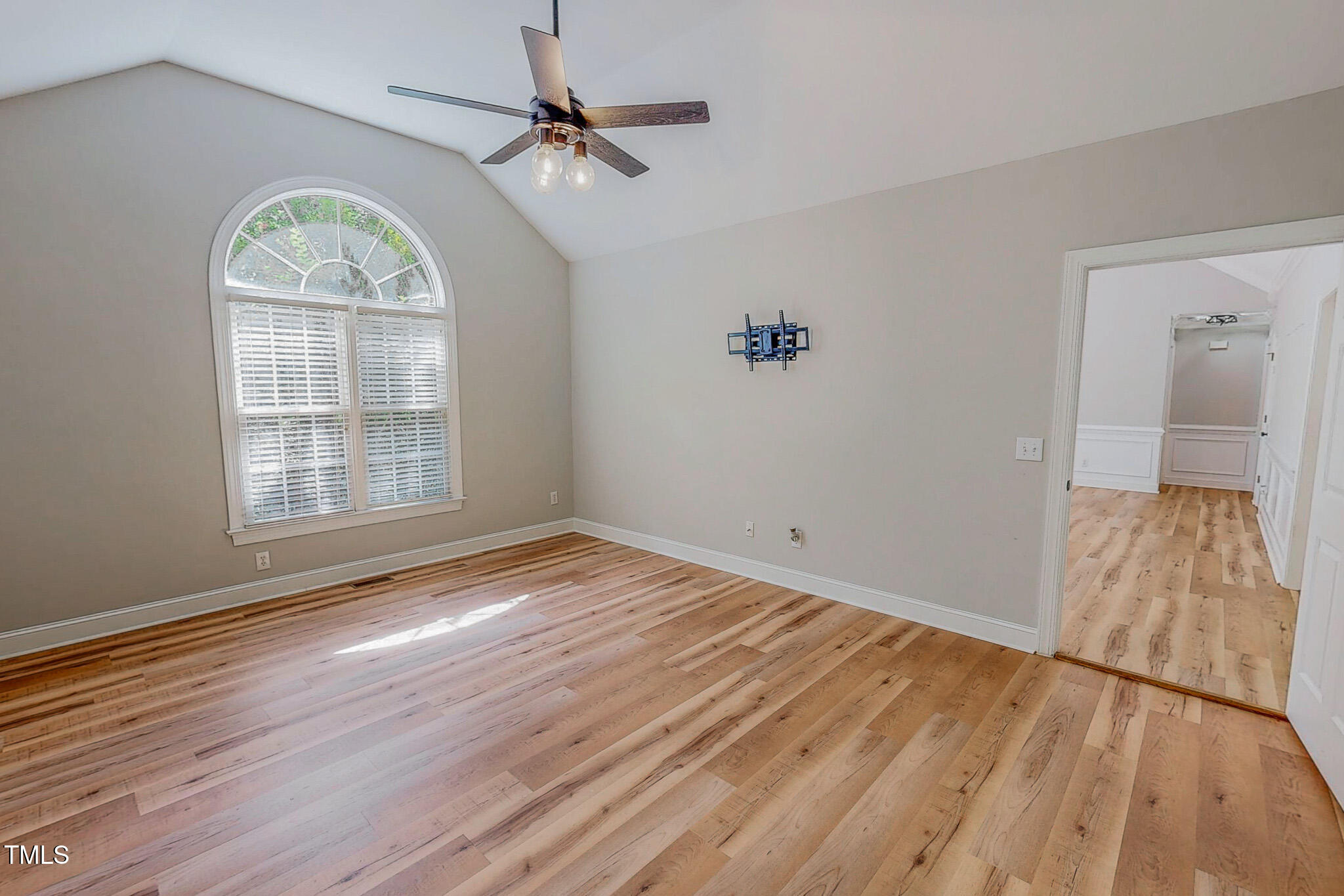 417 Rassie Crabtree Road Rougemont, NC 27572 - Photo 26 of 37 an empty room with wooden floor chandelier fan and windows