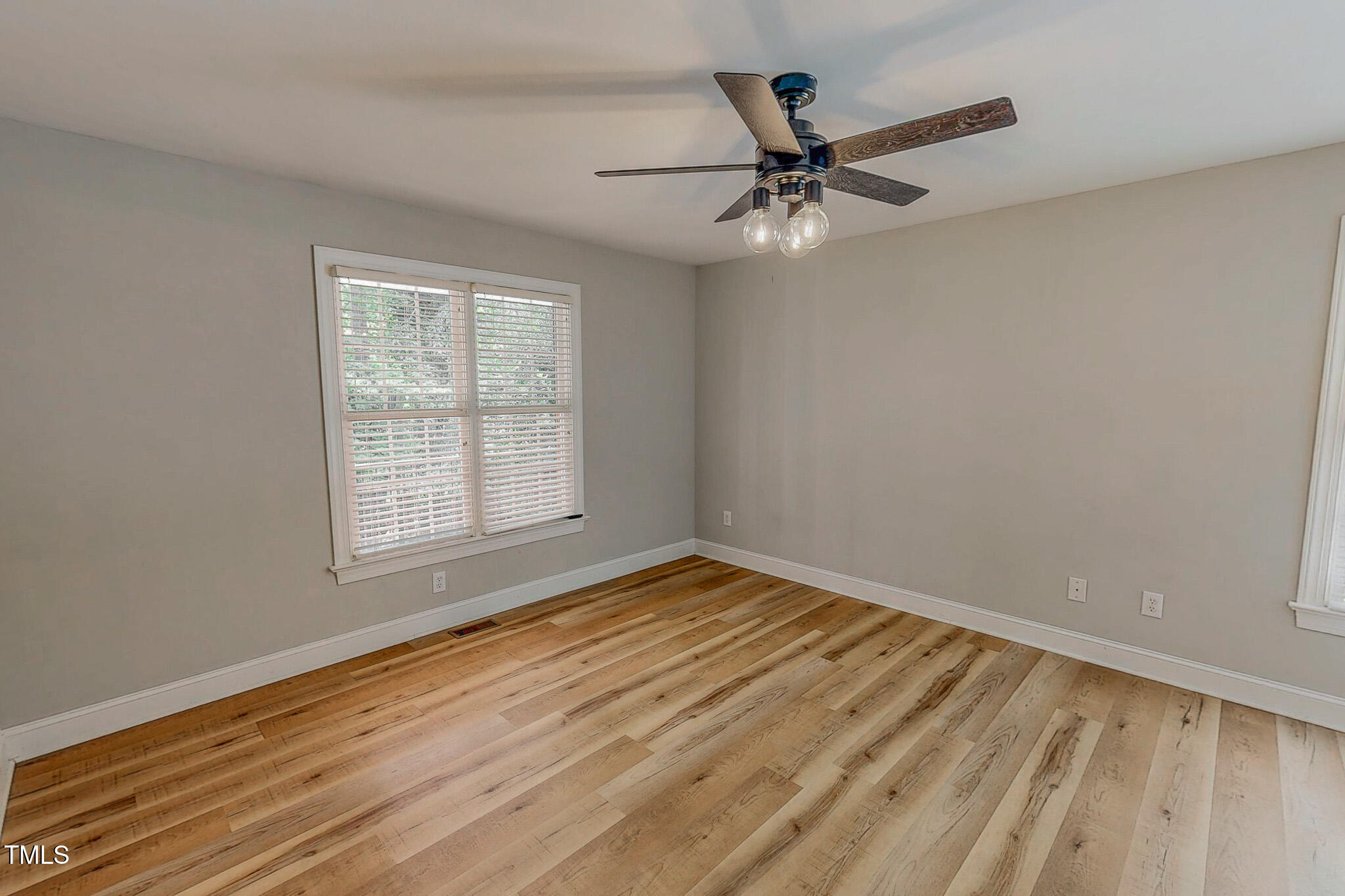 417 Rassie Crabtree Road Rougemont, NC 27572 - Photo 29 of 37 a view of an empty room with wooden floor and a window