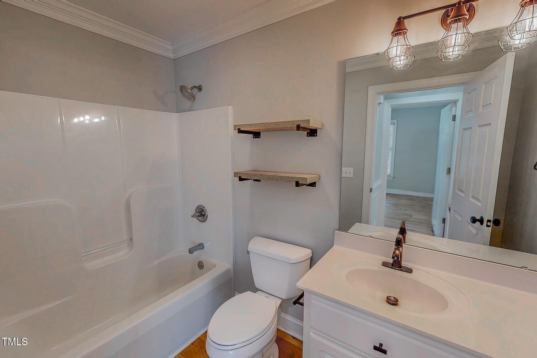417 Rassie Crabtree Road Rougemont, NC 27572 - Photo 32 of 37 a bathroom with a sink toilet and shower