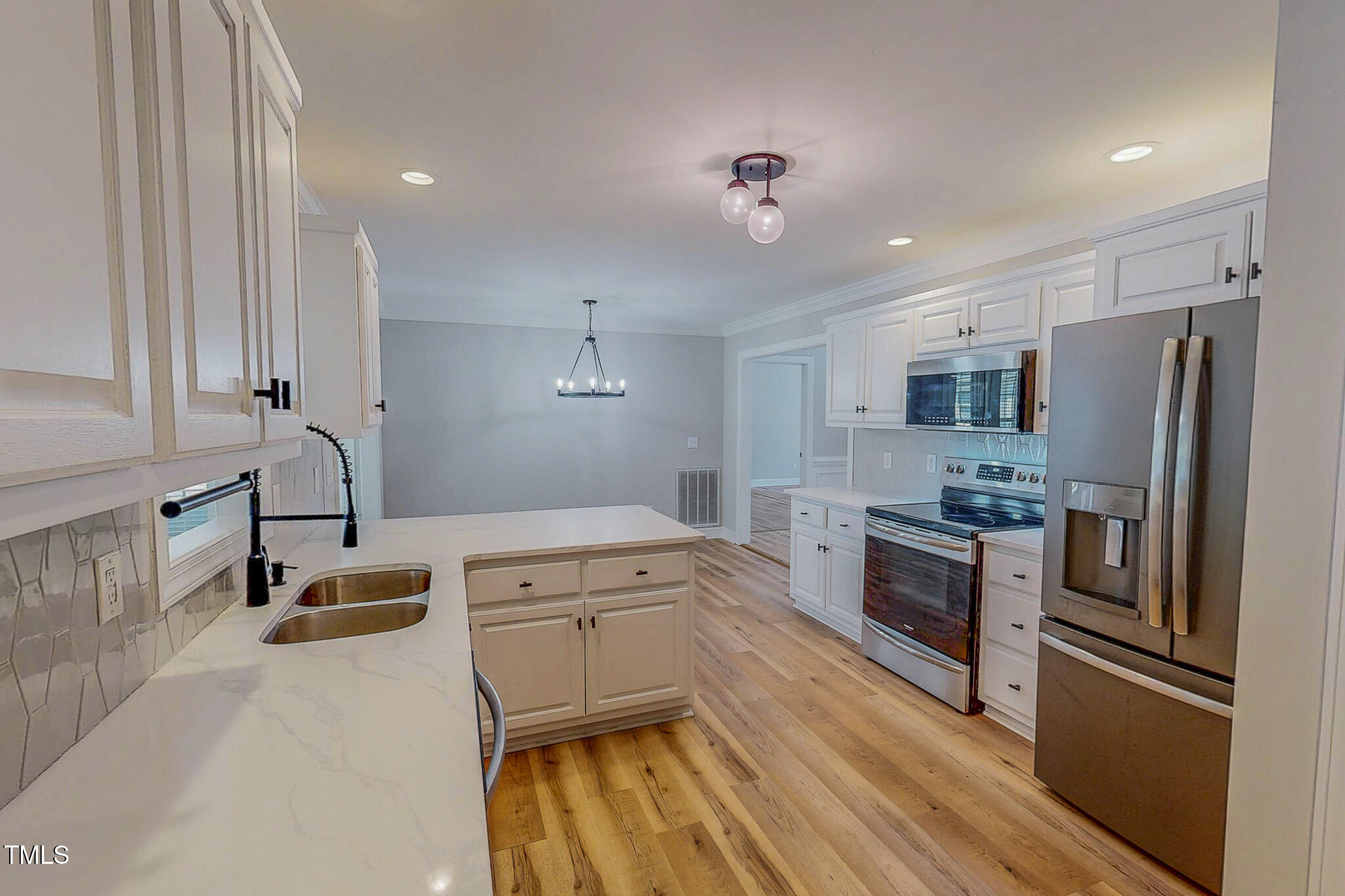417 Rassie Crabtree Road Rougemont, NC 27572 - Photo 10 of 37 a kitchen that has a lot of cabinets in it and stainless steel appliances