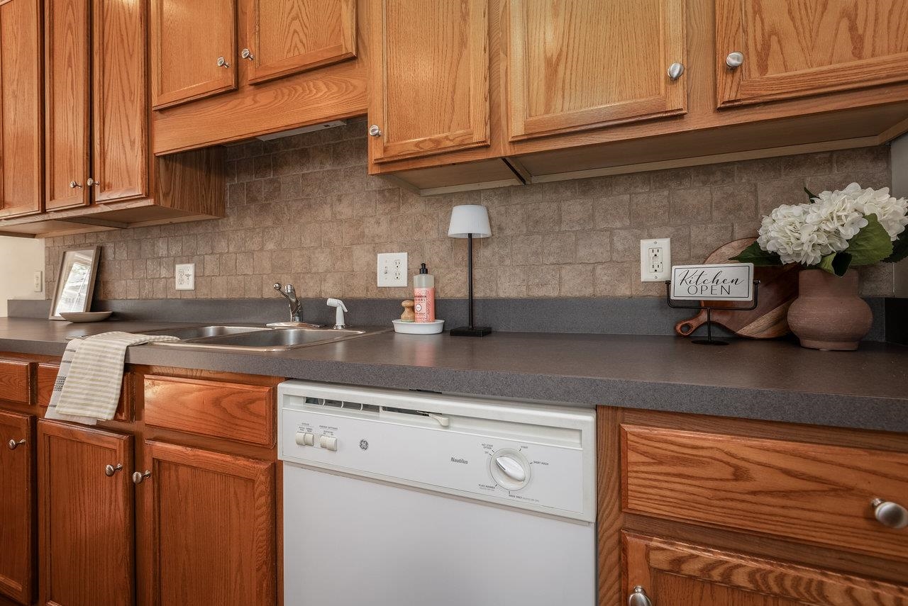 1398 Verdant Spring Lane Harrisonburg, VA 22801 - Photo 12 of 43 a kitchen with stainless steel appliances granite countertop a sink a stove and cabinets