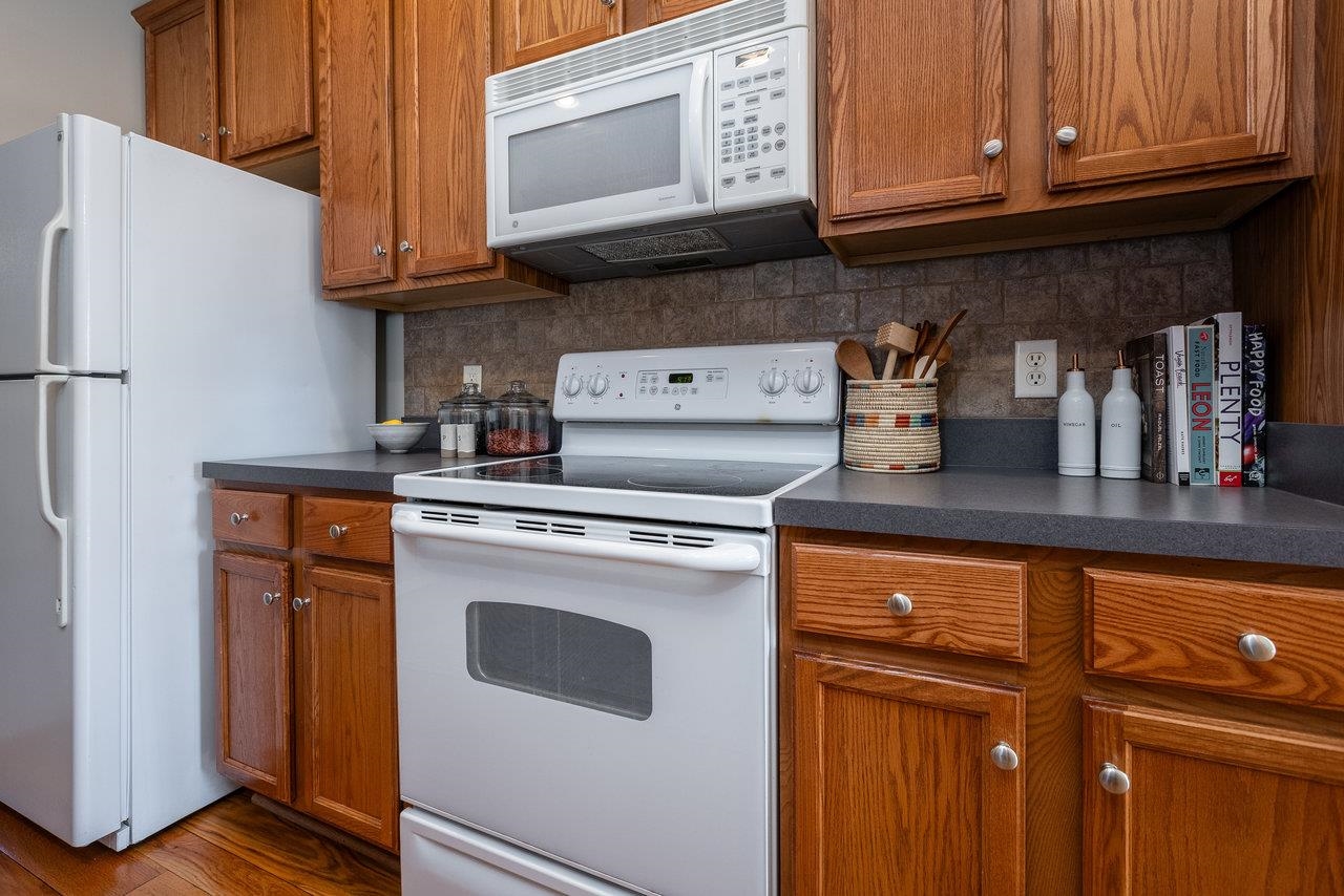 1398 Verdant Spring Lane Harrisonburg, VA 22801 - Photo 15 of 43 a kitchen with stainless steel appliances granite countertop a refrigerator stove and cabinets