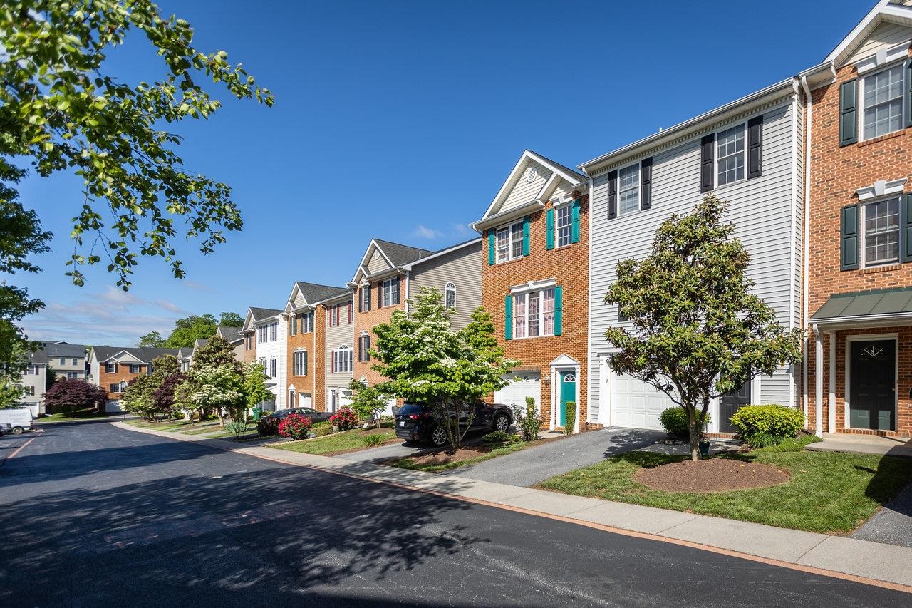 1398 Verdant Spring Lane Harrisonburg, VA 22801 - Photo 2 of 43 a front view of a house with a yard and a garage