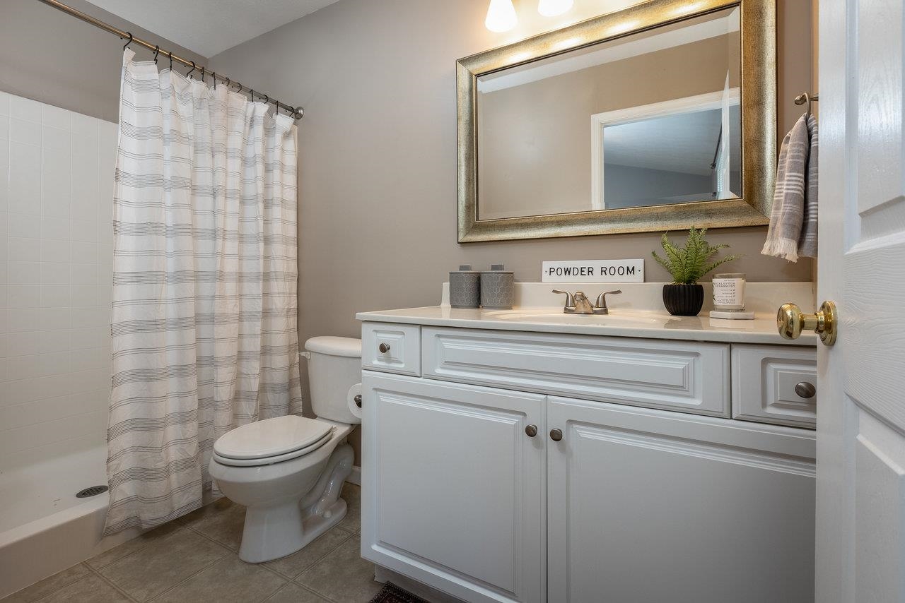 1398 Verdant Spring Lane Harrisonburg, VA 22801 - Photo 31 of 43 a bathroom with a toilet sink and mirror