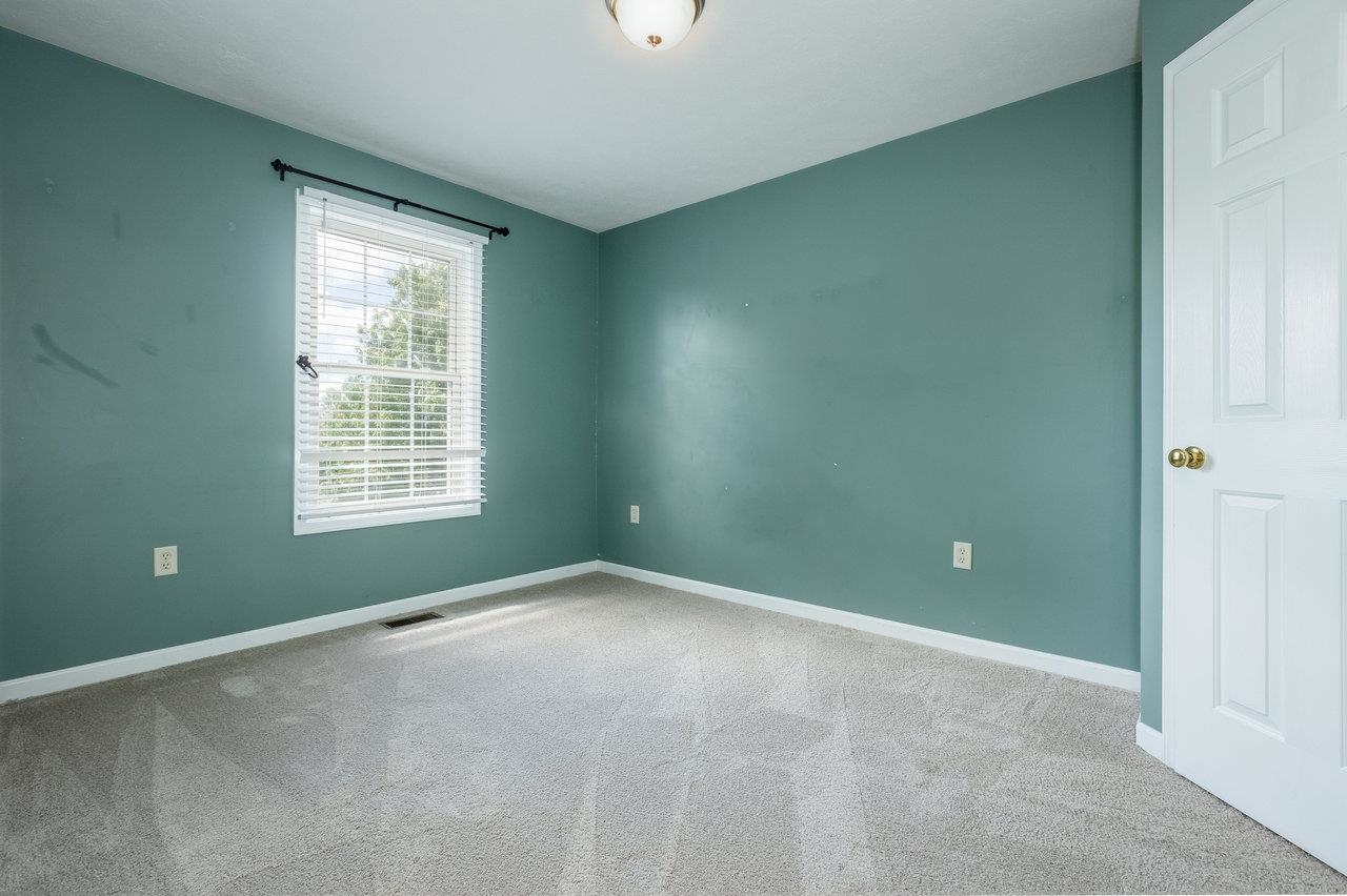 1398 Verdant Spring Lane Harrisonburg, VA 22801 - Photo 36 of 43 an empty room with windows and closet