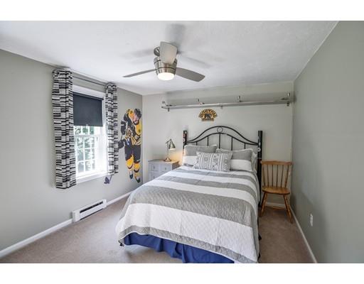 406 Sterling Road Holden, MA 01522 - Photo 19 of 42 a bedroom with a bed mirror and a window