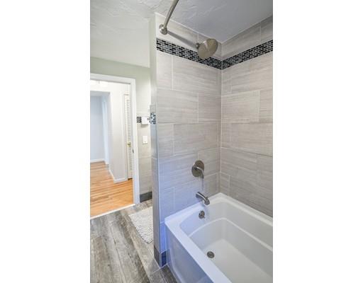 406 Sterling Road Holden, MA 01522 - Photo 23 of 42 a bathroom with a tub shower vanity and a sink