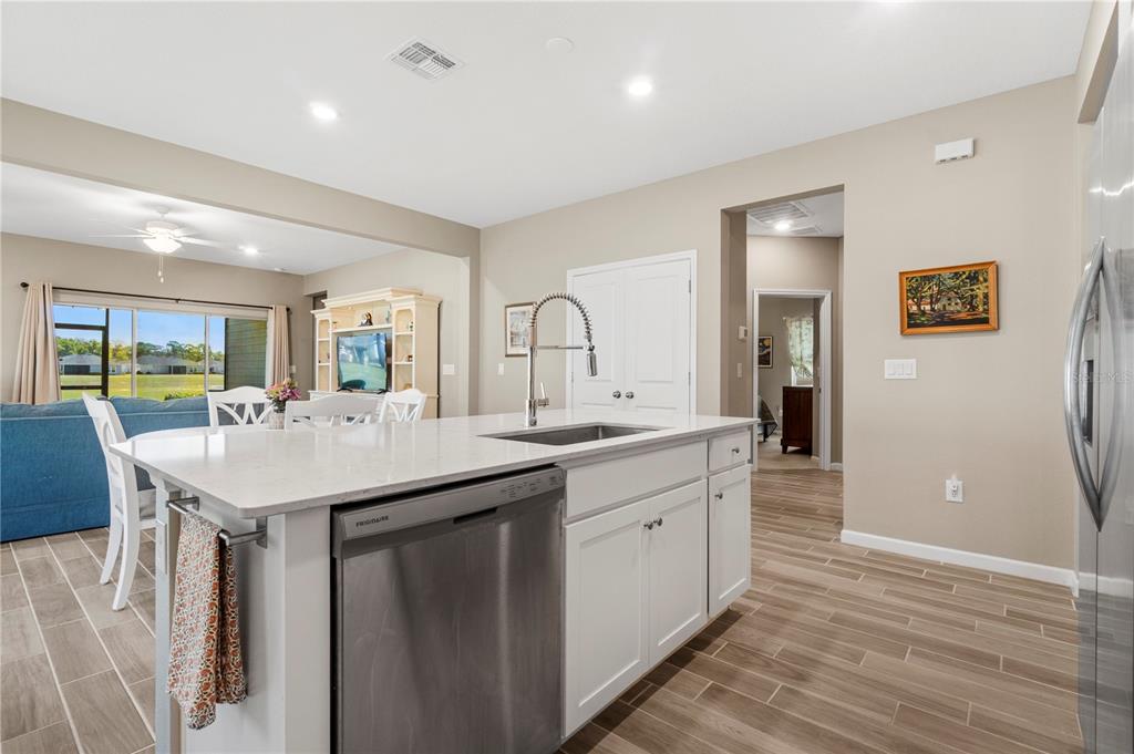 7381 Southwest 78th Terrace Ocala, FL 34474 - Photo 11 of 47 a kitchen with a sink and a refrigerator