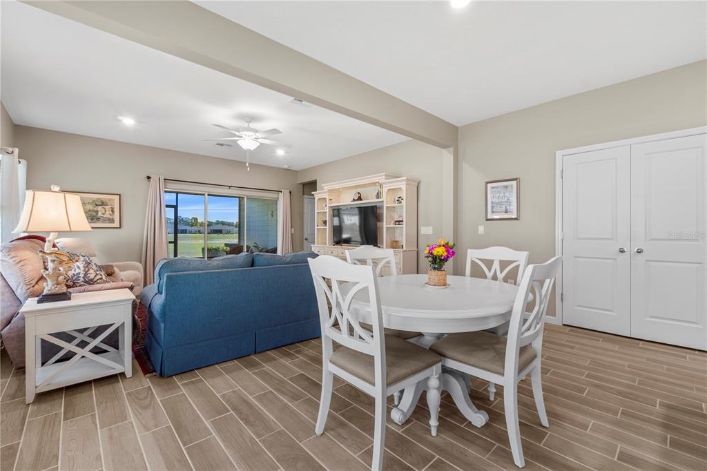 7381 Southwest 78th Terrace Ocala, FL 34474 - Photo 13 of 47 a view of a dining room with furniture window and wooden floor