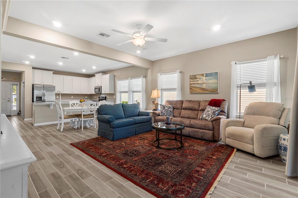 7381 Southwest 78th Terrace Ocala, FL 34474 - Photo 16 of 47 a living room with furniture and a rug