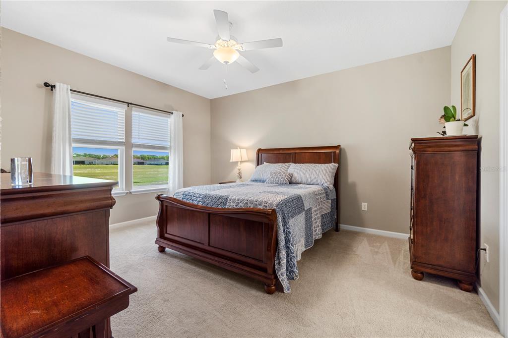7381 Southwest 78th Terrace Ocala, FL 34474 - Photo 17 of 47 a bed room with a bed and a window