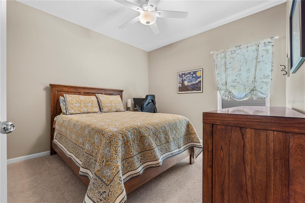 7381 Southwest 78th Terrace Ocala, FL 34474 - Photo 25 of 47 a spacious bedroom with a bed and a window
