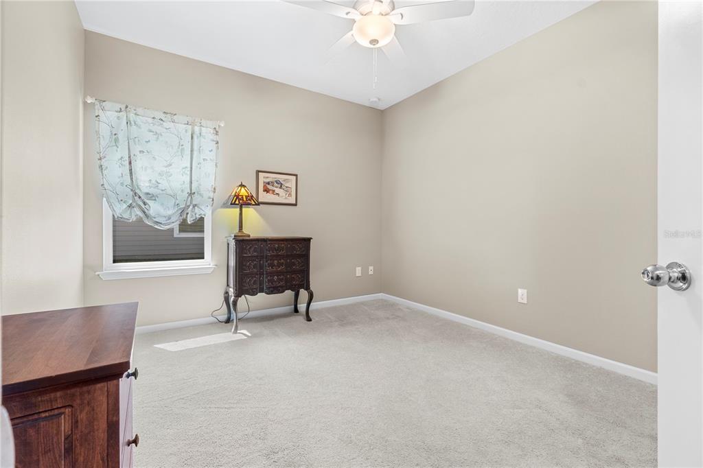 7381 Southwest 78th Terrace Ocala, FL 34474 - Photo 29 of 47 an empty room with windows and fan