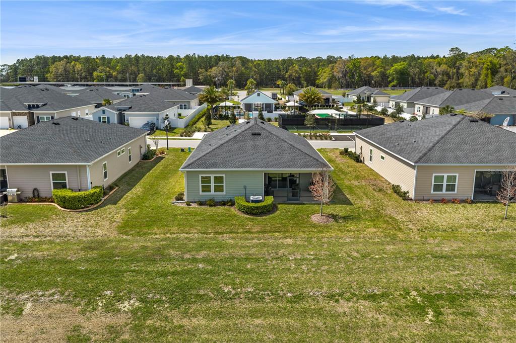 7381 Southwest 78th Terrace Ocala, FL 34474 - Photo 36 of 47 an aerial view of residential houses with outdoor space and trees