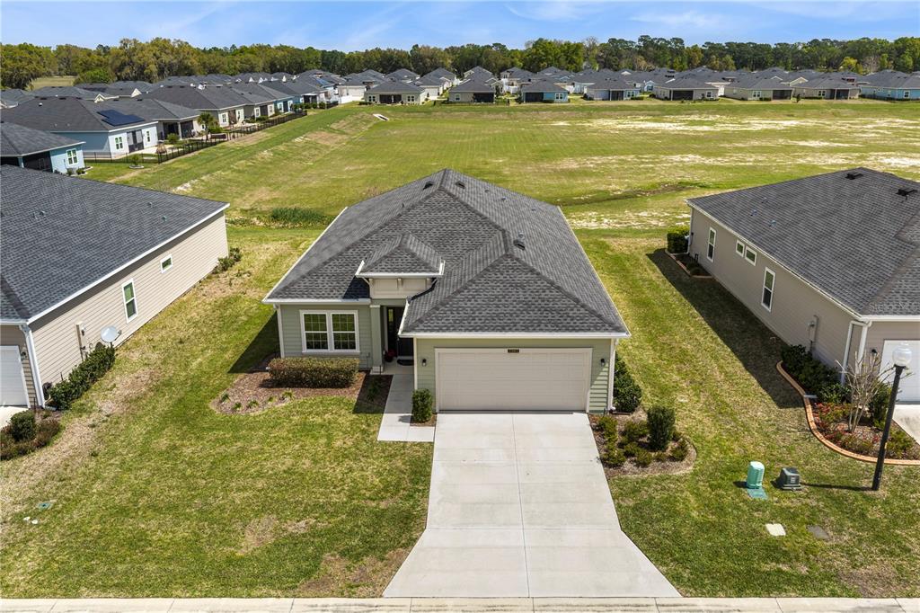 7381 Southwest 78th Terrace Ocala, FL 34474 - Photo 37 of 47 a aerial view of a house with a lake view