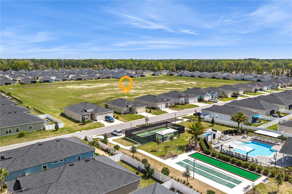 7381 Southwest 78th Terrace Ocala, FL 34474 - Photo 45 of 47 an aerial view of residential building and lake