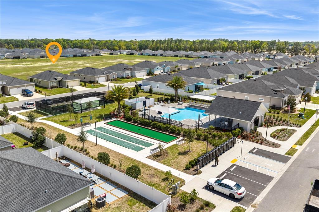 7381 Southwest 78th Terrace Ocala, FL 34474 - Photo 46 of 47 an aerial view of a city with lots of residential buildings and mountain view in back