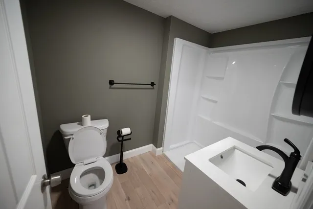 a bathroom with a toilet and a sink
