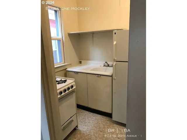 a view of a kitchen with a sink
