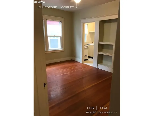 a view of an empty room and window