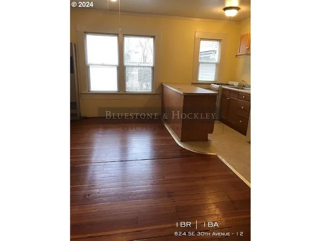 a view of a livingroom with furniture and window