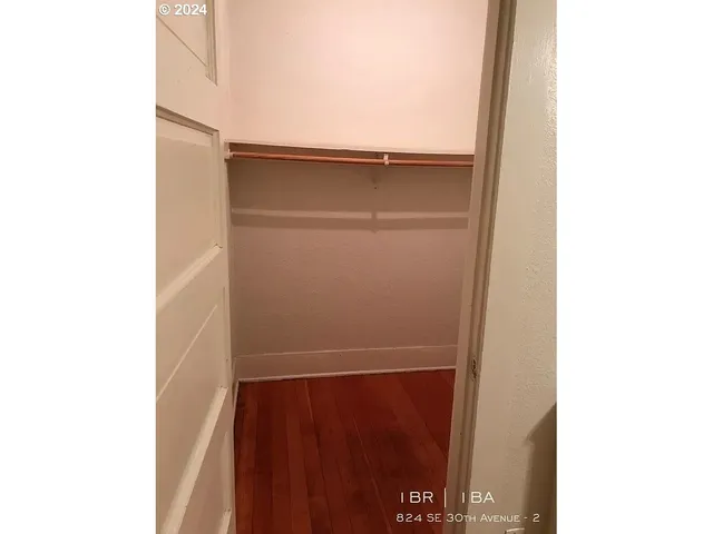 a kitchen with a refrigerator and cabinets