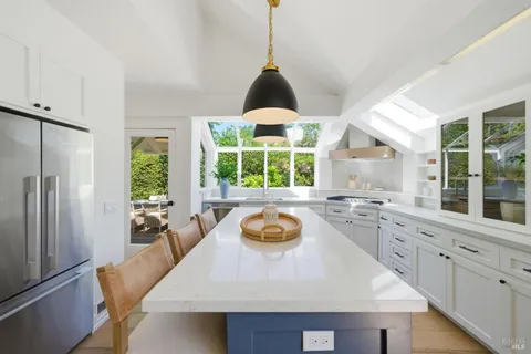 a kitchen with a sink and a stove