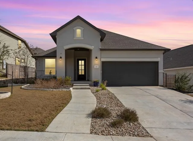 a front view of a house with yard