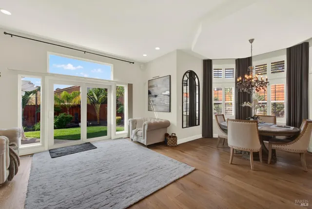 a kitchen with stainless steel appliances kitchen island granite countertop a stove a sink and a refrigerator
