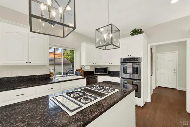 a bathroom with a toilet a sink and a mirror