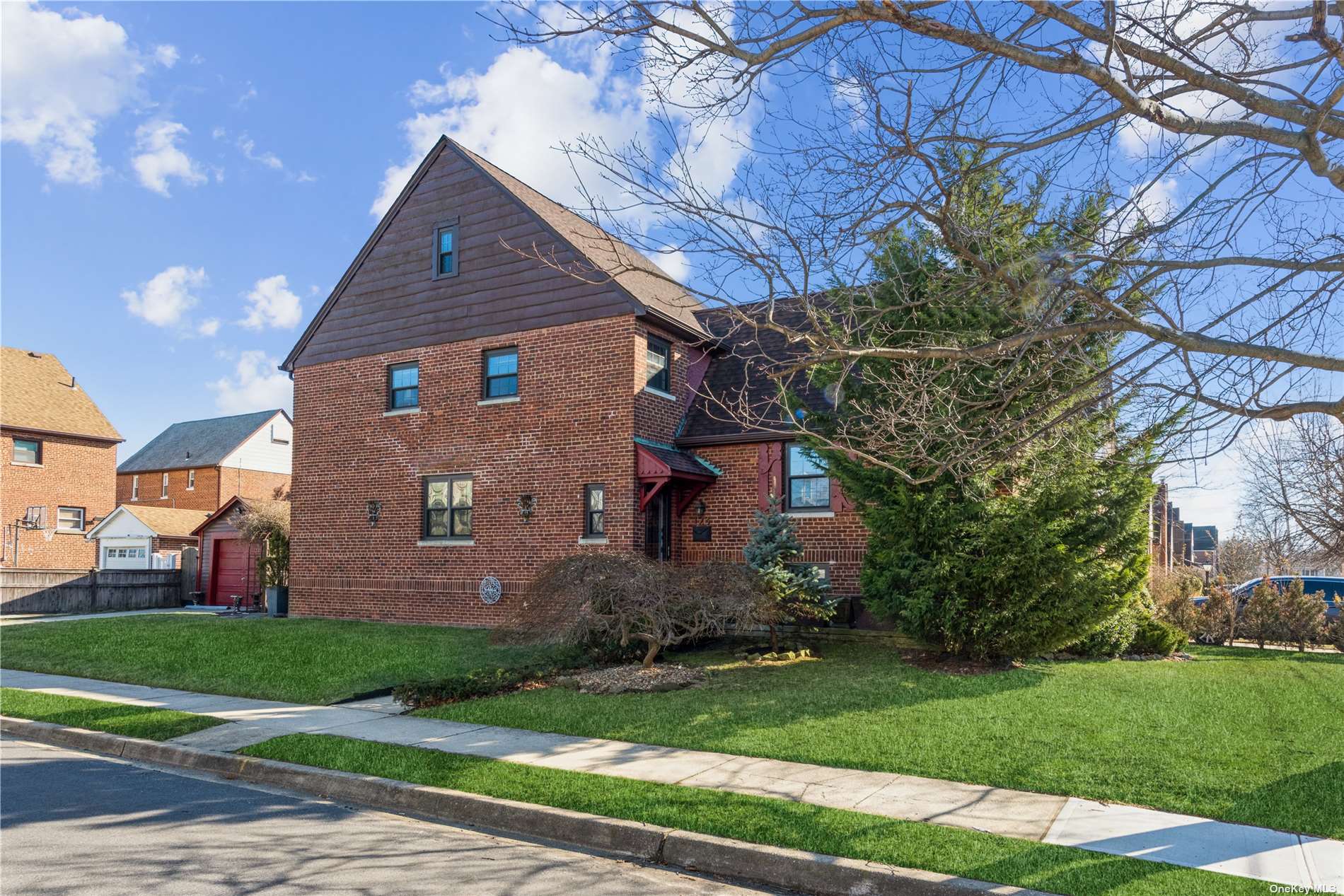 123 Amherst Road Valley Stream, NY 11581 - Photo 1 of 1 a front view of house with yard and green space