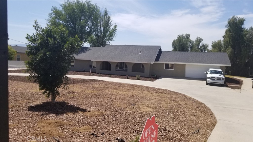 17165 Cole Avenue Riverside, CA 92508 - Photo 1 of 1 a front view of a house with a yard covered with snow