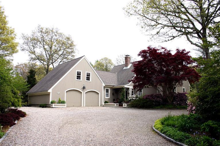 32 Pochet Road Orleans, MA 02653 - Photo 2 of 32 a front view of a house with a garden