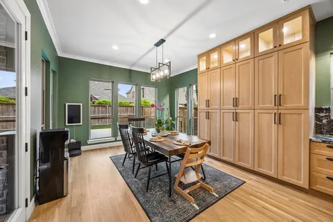 a kitchen with kitchen island a stove and a sink