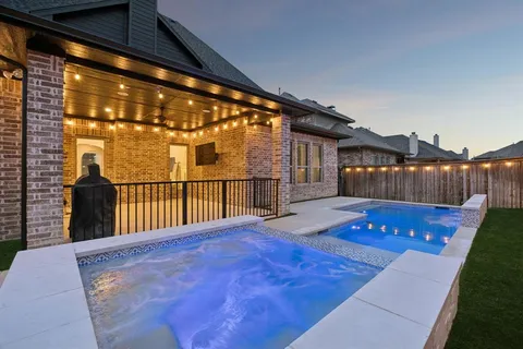 a view of swimming pool with wooden floor