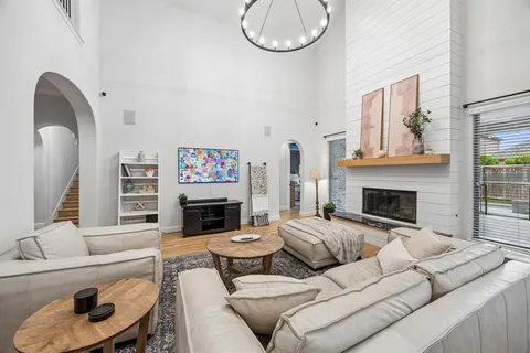 a kitchen with stainless steel appliances granite countertop a stove and a wooden floors
