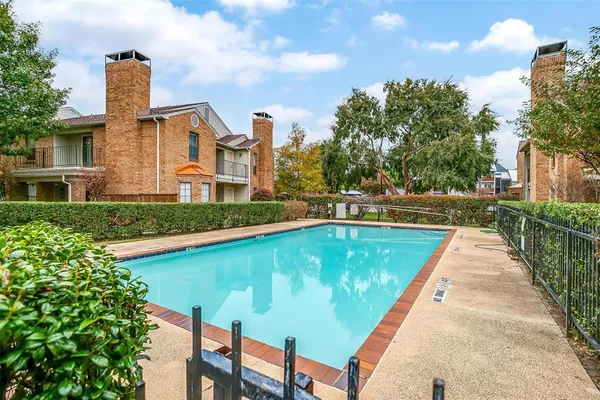 a view of swimming pool with a yard