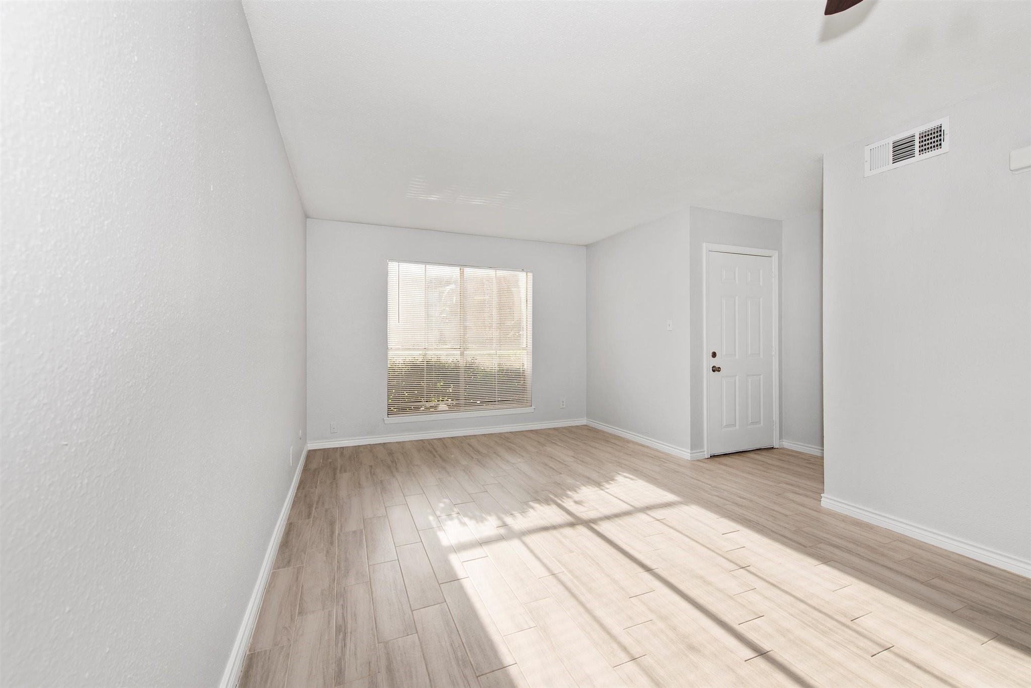 6200 West Tidwell Road, Unit 1613 Houston, TX 77092 - Photo 16 of 16 an empty room with wooden floor and windows