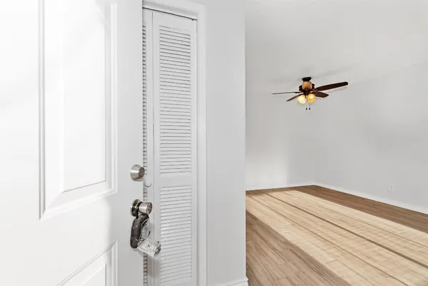 a view of a hallway with closet