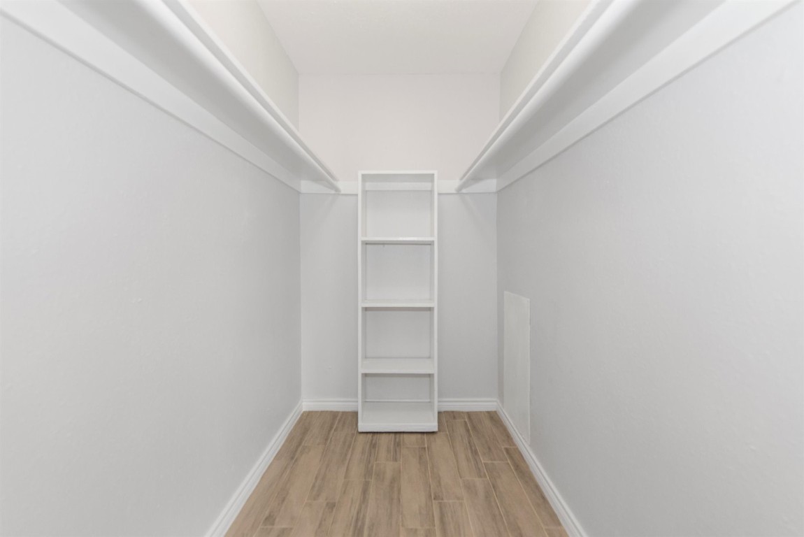 6200 West Tidwell Road, Unit 1613 Houston, TX 77092 - Photo 6 of 16 a view of a room with wooden floor