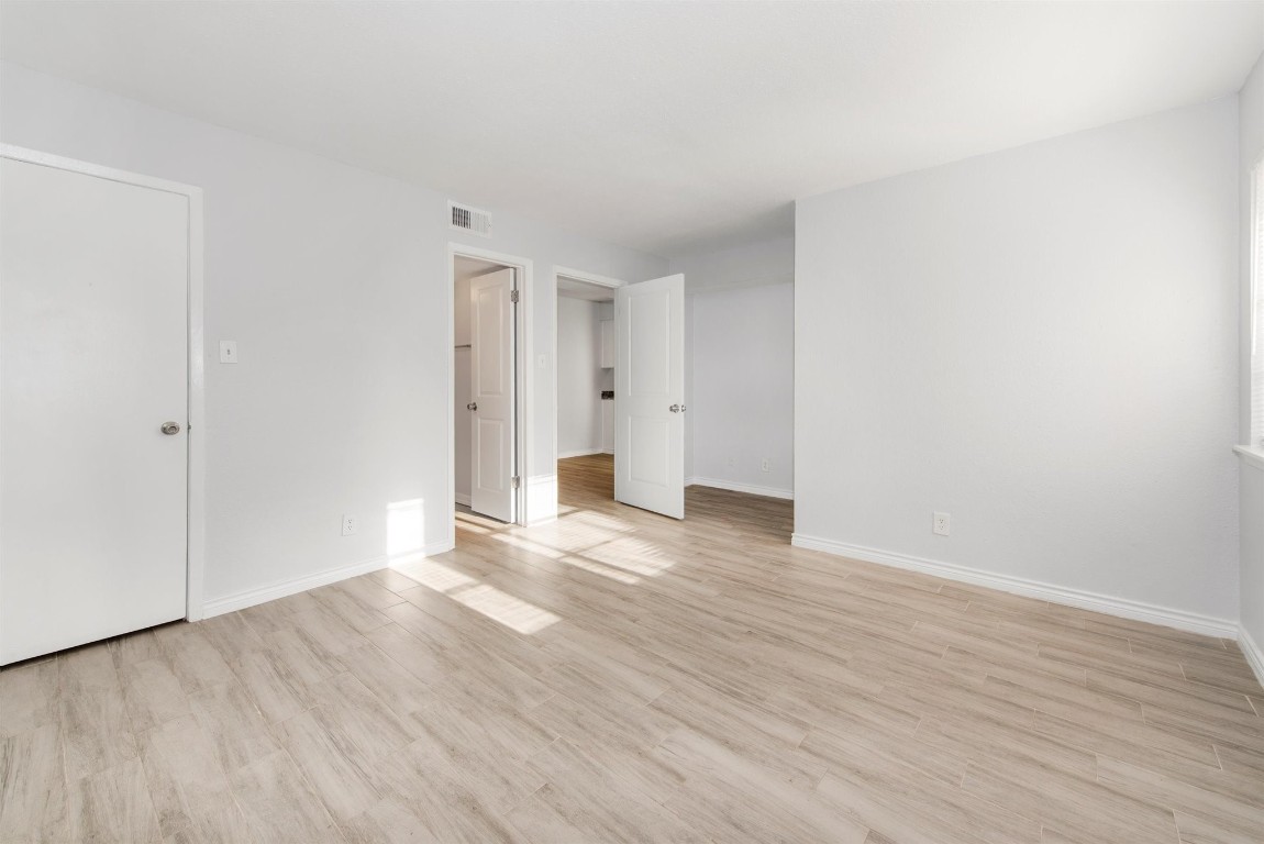 6200 West Tidwell Road, Unit 1613 Houston, TX 77092 - Photo 7 of 16 a view of an empty room with wooden floor